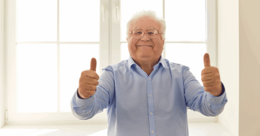 senior with thumbs up