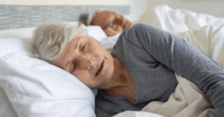 an elderly couple sleeping peacefully
