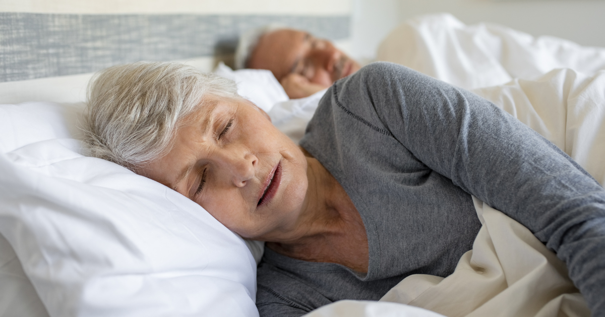 an elderly couple sleeping peacefully