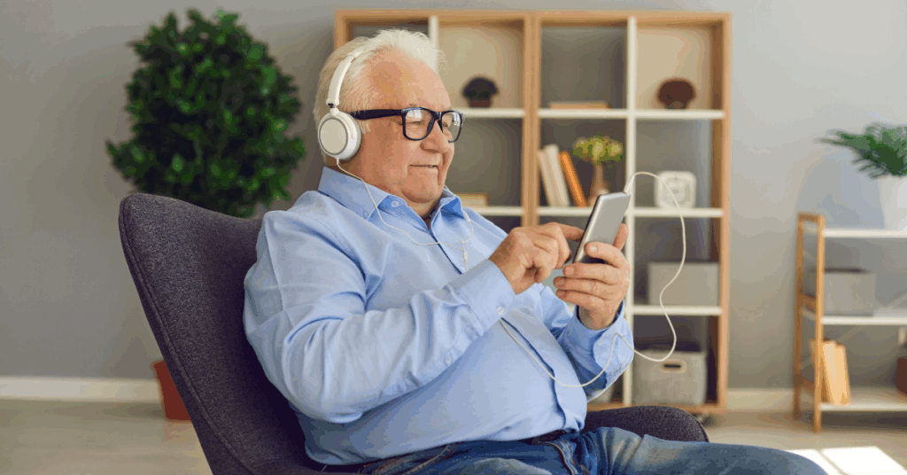 an old men listening to something in his phone